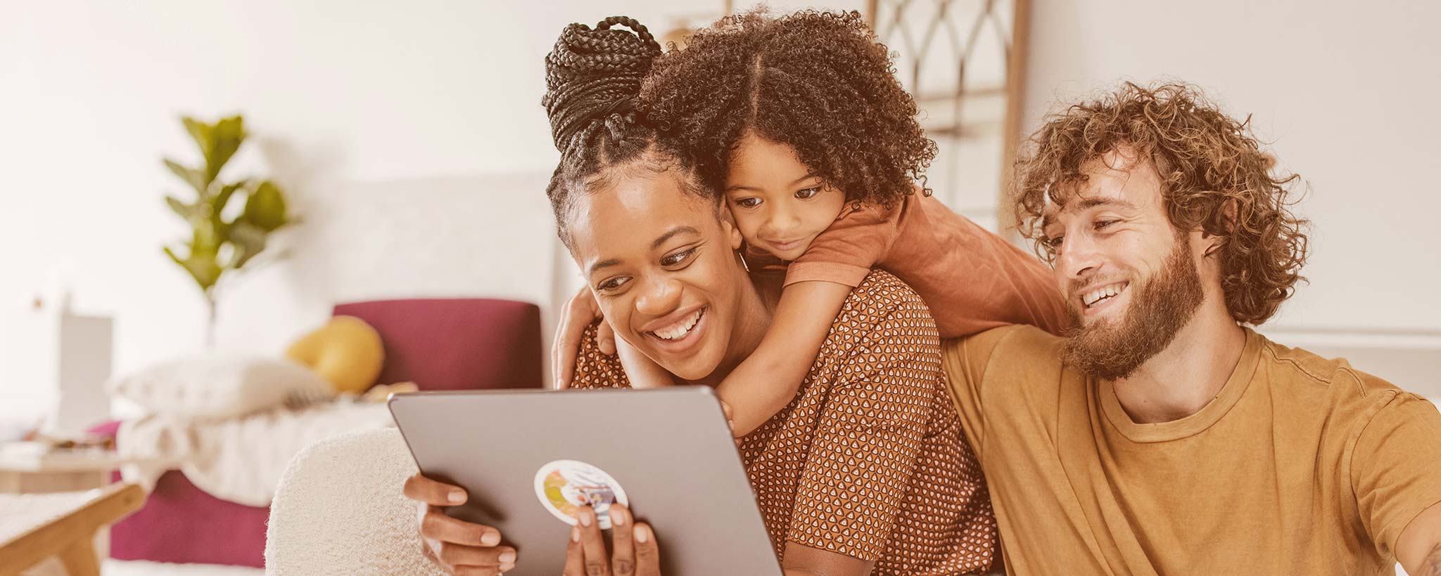 Family looking at laptop