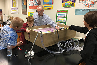 Chris Saucier with students