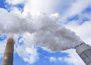 cloud of water vapor rising from a chimney