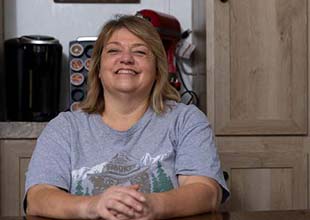 Cynthia Lee in her manufactured home