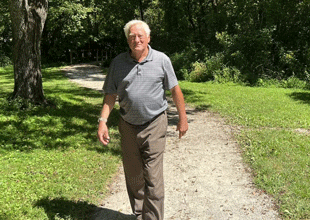 An older adult enjoying hiking in Norris trail