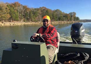 Levi Yancey in motor boat