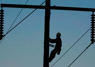 lineman climbing a pole