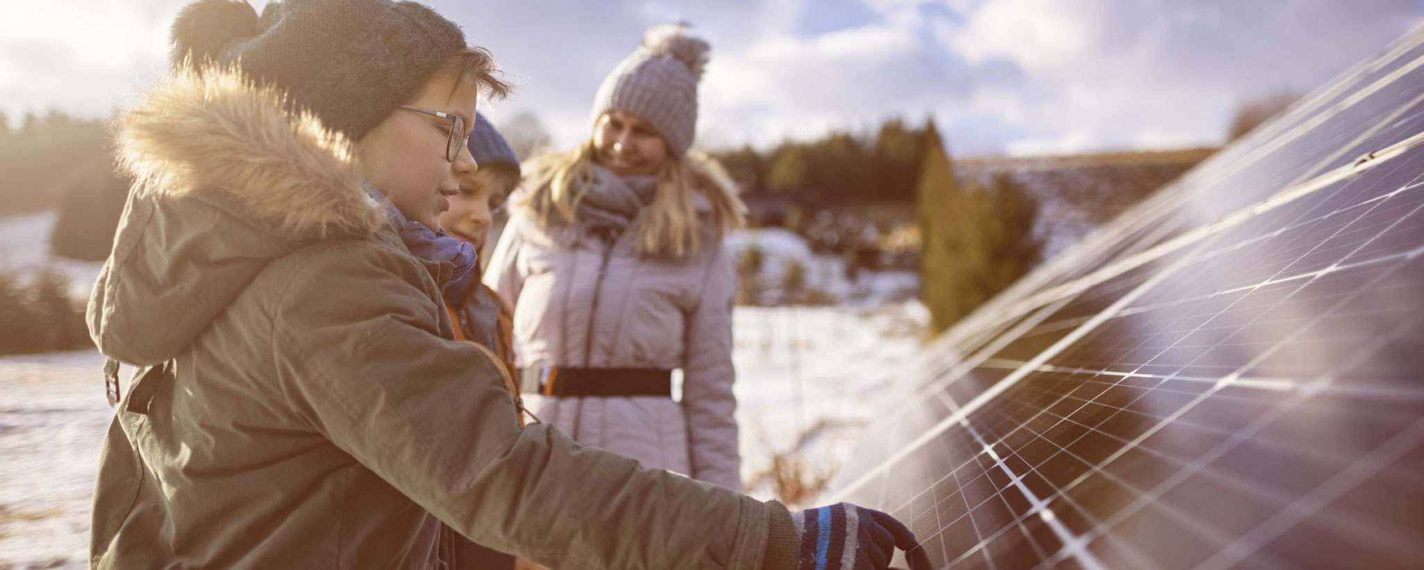 Students looking at the solar panel
