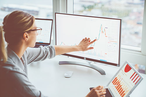 woman pointing at screen