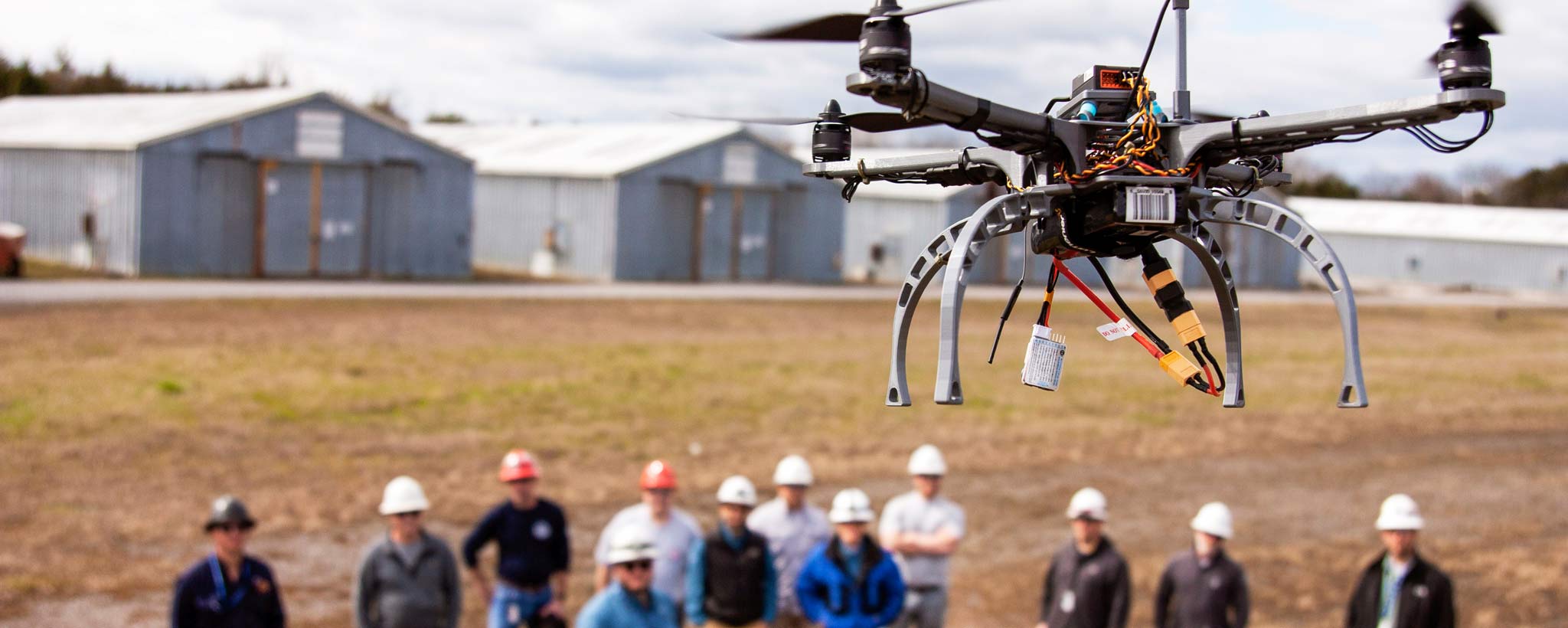Students learning to fly drone