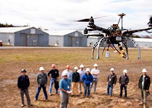 Students learning to fly drone