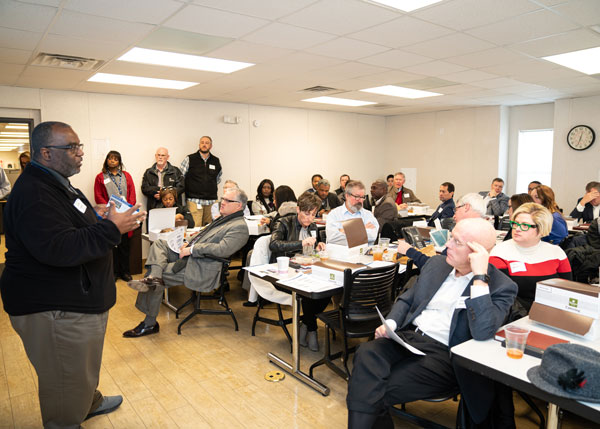 TVA employee presenting to a room full of people seated at tables