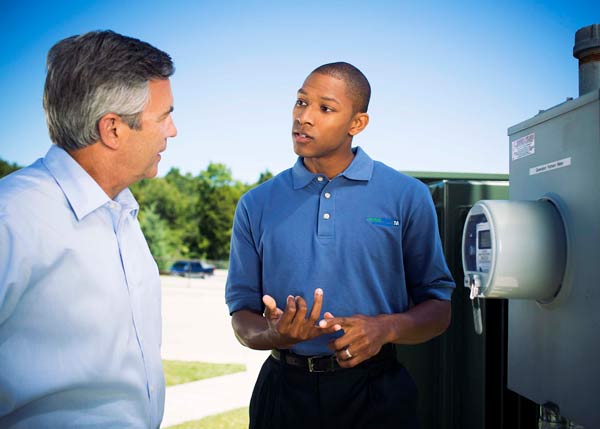 Technician explaining about AMI metering to the customer