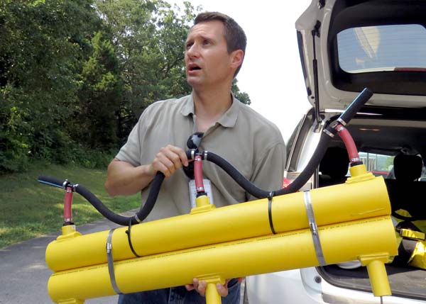 Jeff Ogden holding lengths of diffuser line