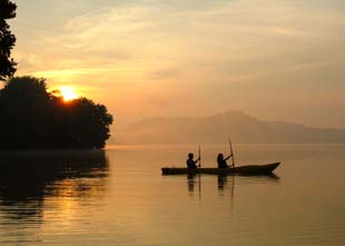 Kayaking in a lake during sunset