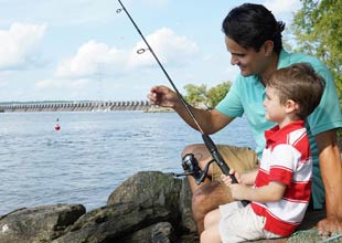 Dad and son fishing in a lake