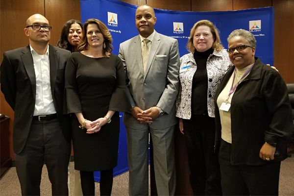 Representatives from TVA, MLGW, and MIFA celebrate Share Your Pennies at the MLGW board meeting.
